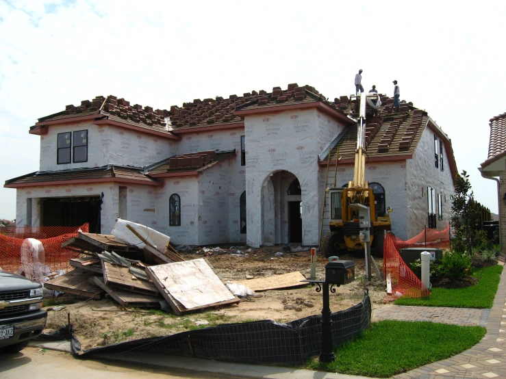 a building that has been ripped down and other debris in front