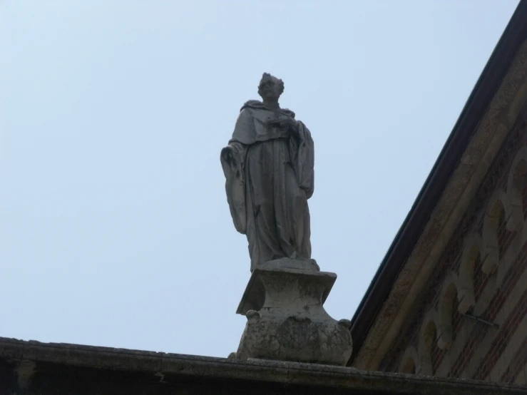 the statue is overlooking the buildings from below