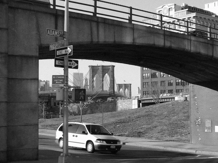 a car is on the road under an overpass