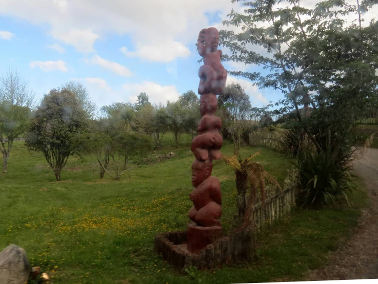 a very big stone thing on the side of a road