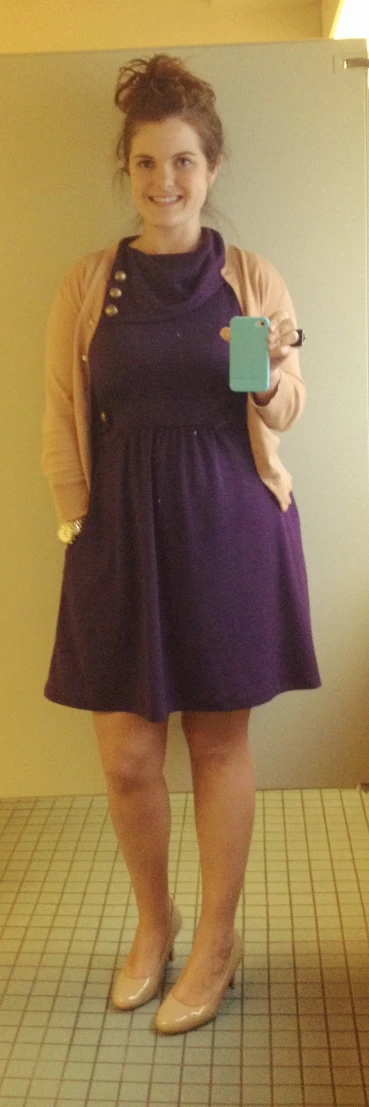 a woman is posing with a mirror and towel