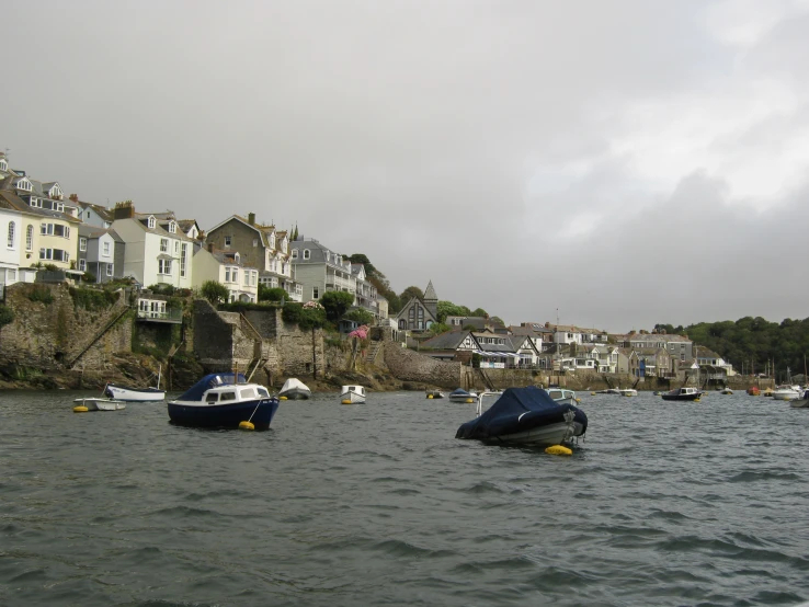 the boats in the water are all lined up