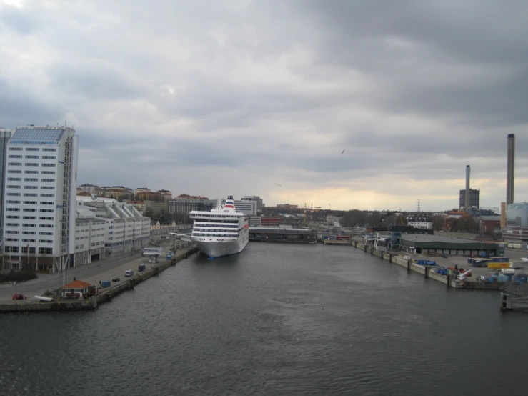 the big cruise ship is docked in the harbor