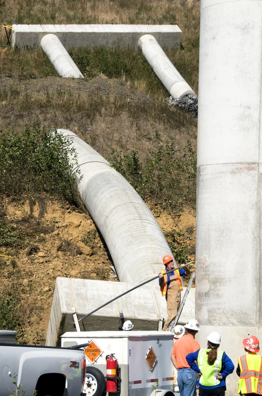 there is a large pipe laying near the road