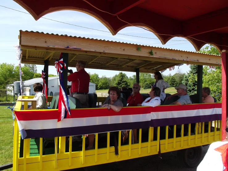 a train car full of people traveling in the same direction