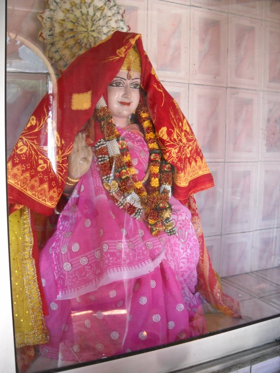 a large figurine of a person wearing a saree