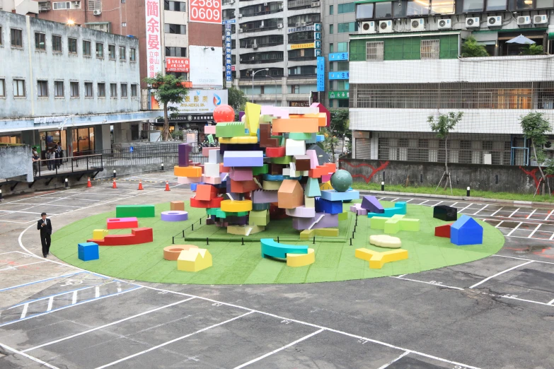 the view of a huge sculpture made of colored blocks