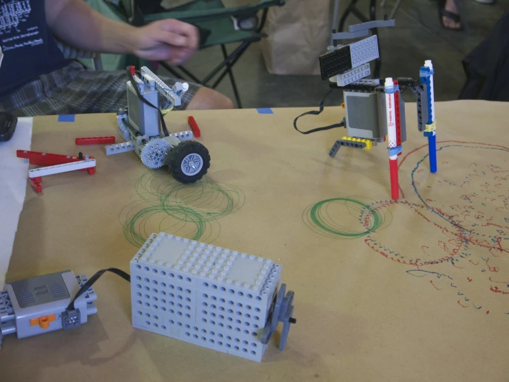 lego blocks and other toys are on the table