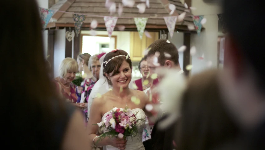 a bride walking down the aisle of her wedding