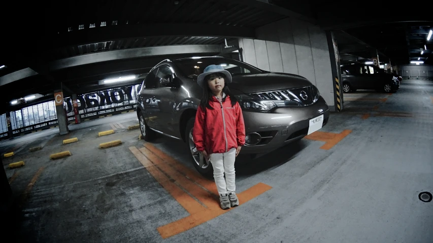 a man is standing in front of his car