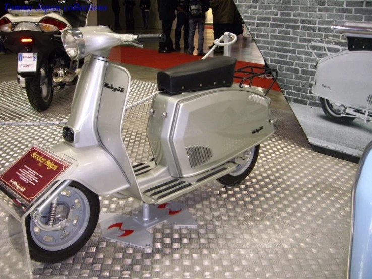 a moped is on display at a show