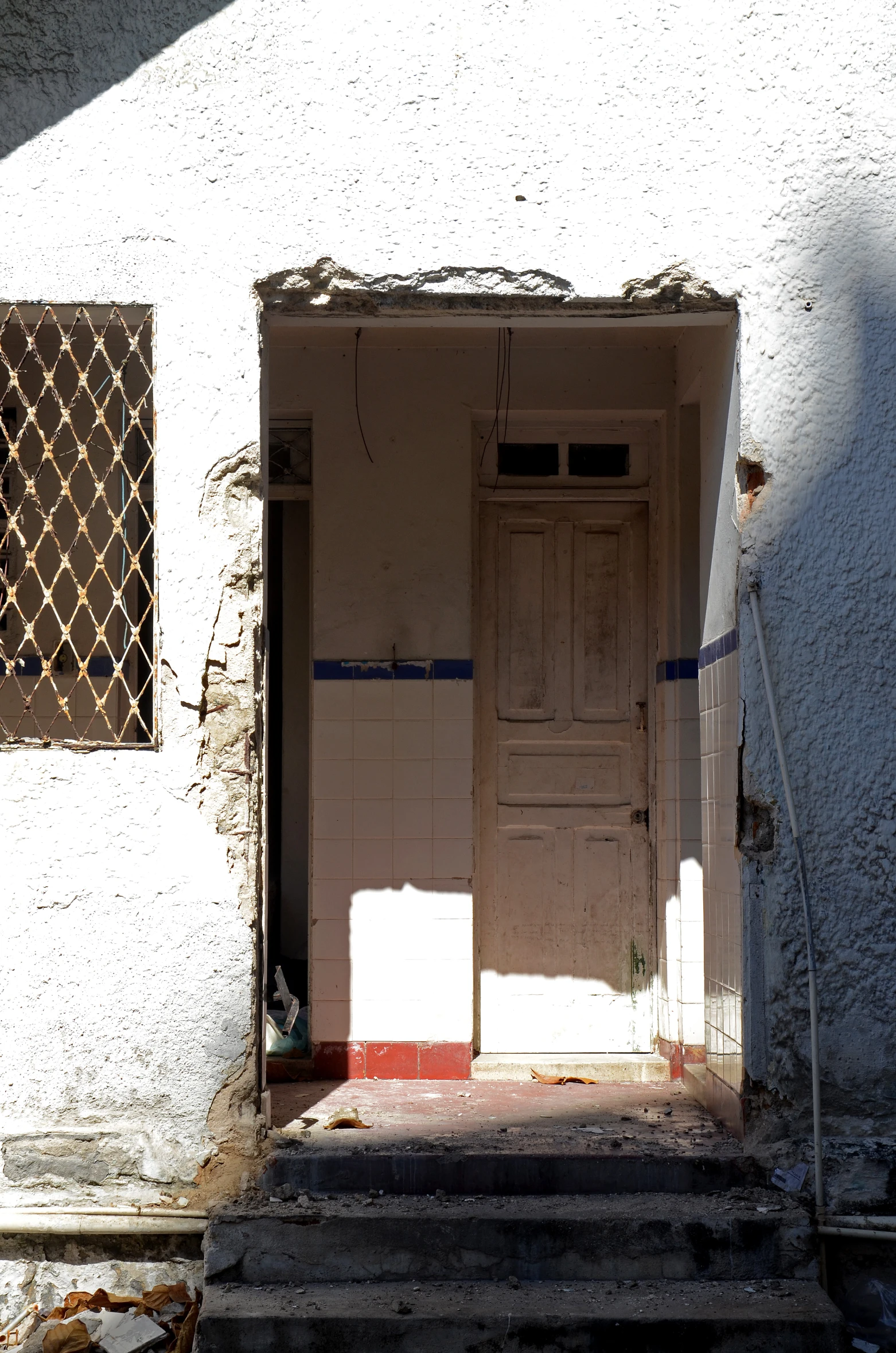 two doors are open on this old run down building