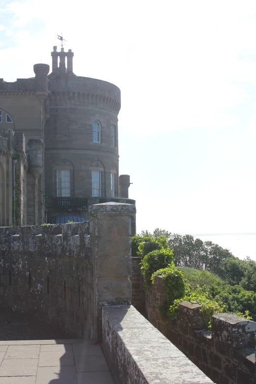 this large building has a long stone wall