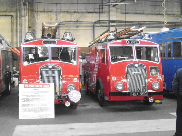 three fire trucks parked next to each other