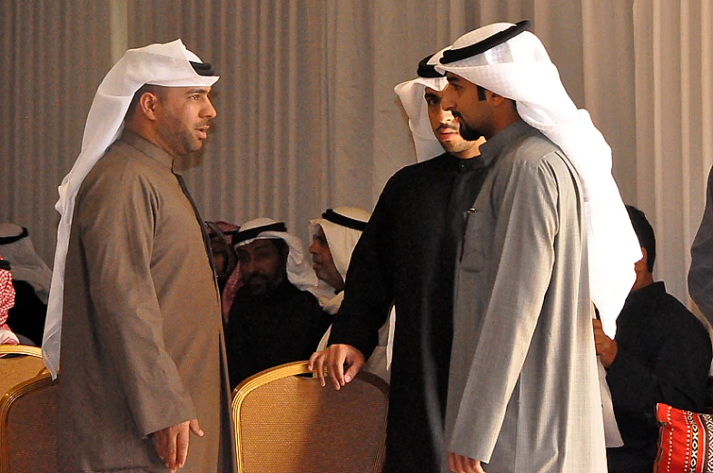 two men in traditional garb standing next to each other