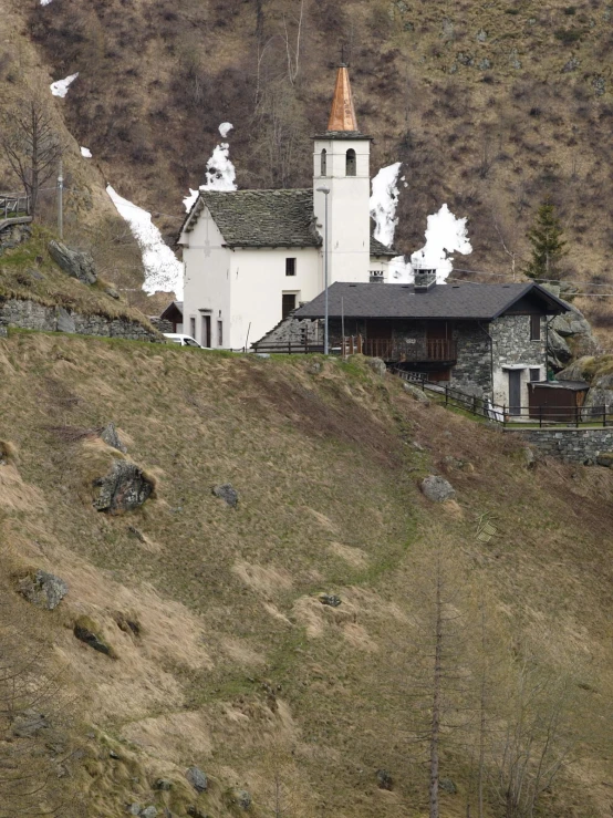 the building on the side of the hill is a church