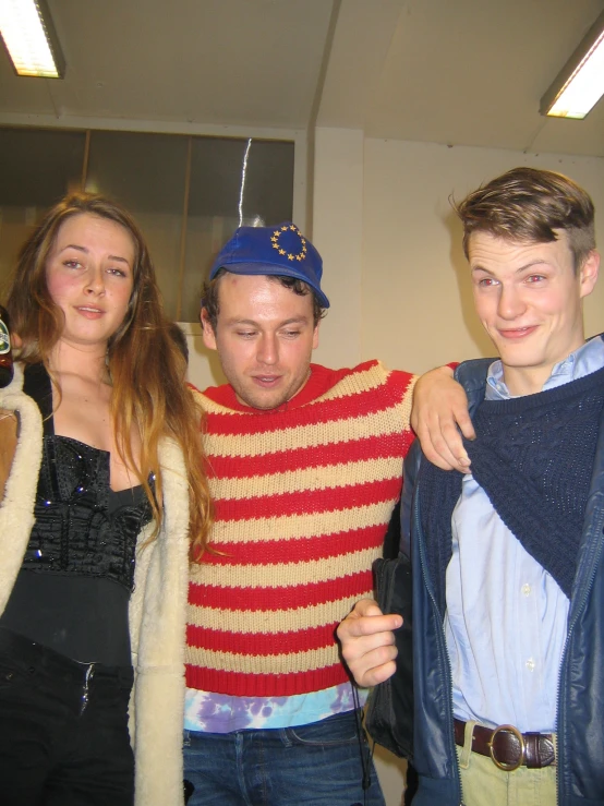 four people dressed in various styles, and posing for the camera