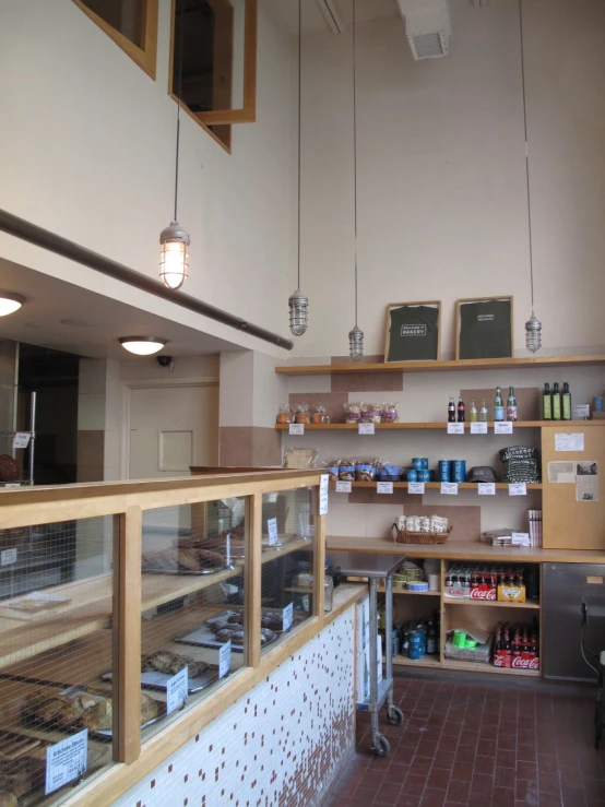 a bakery area with shelves, an open market area and lots of food