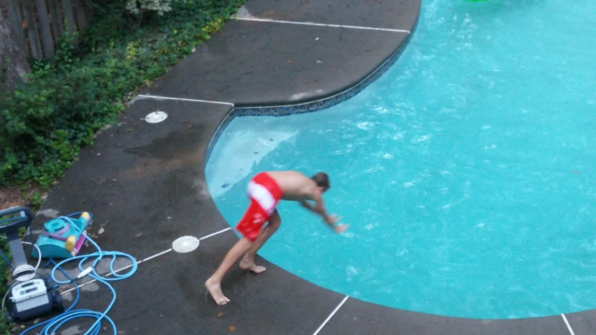 there is a person that is in the water at the pool