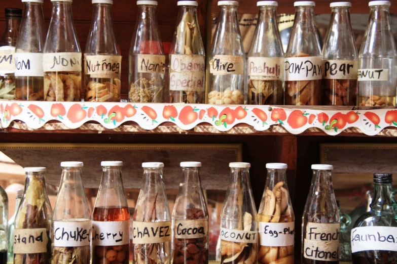 many different bottles sitting on display in a store