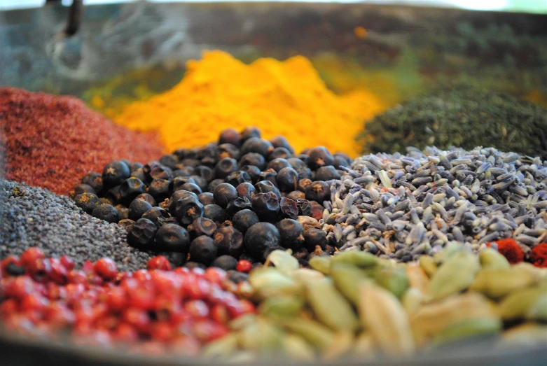 a bunch of beans, sprouts and other colorful spices