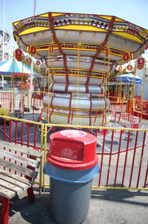 a carousel for children at a carnival rides the carousel