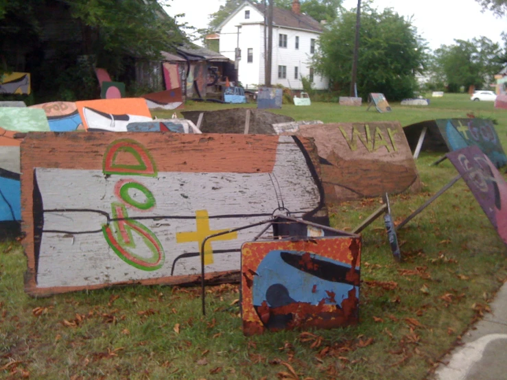 many different signs on grass in a yard