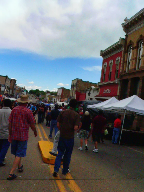 there are several people walking through the street