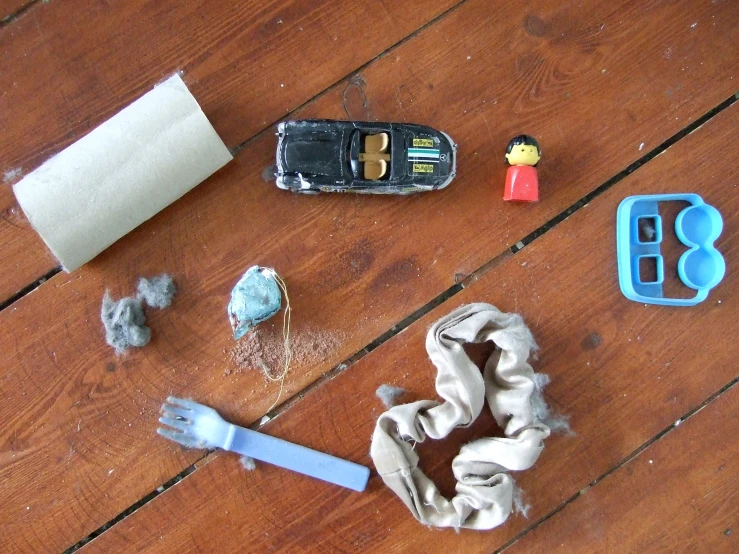 broken toothbrush, toy cell phone and small toys