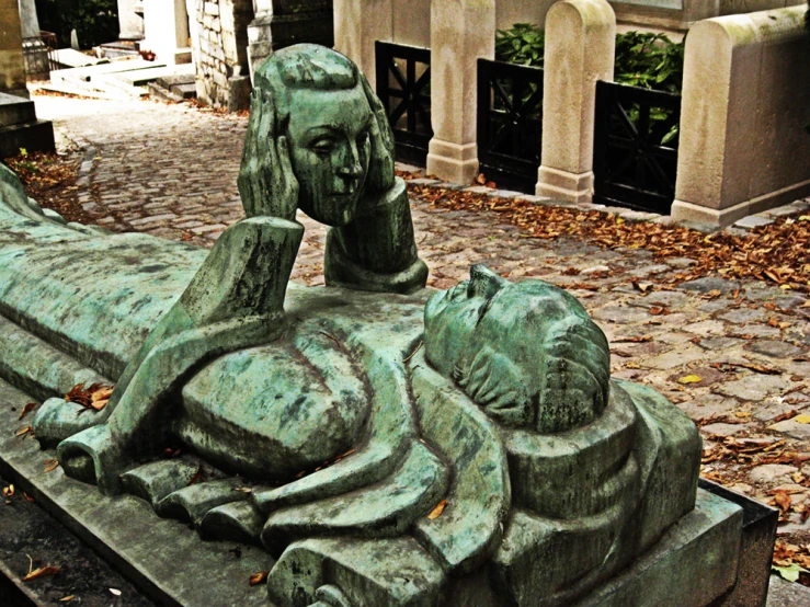 a close up of a statue of an elephant on a bench