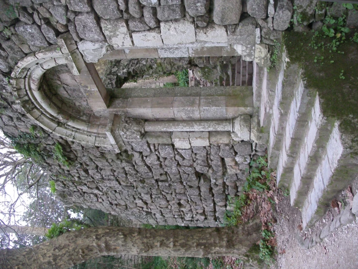 a couple of stairs leading up to an old stone building