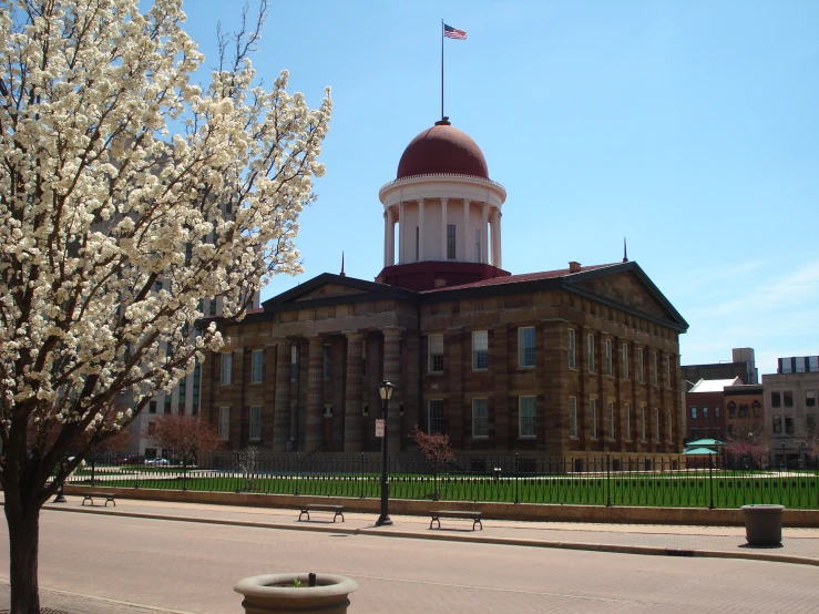 an old building with a tower and a domed roof