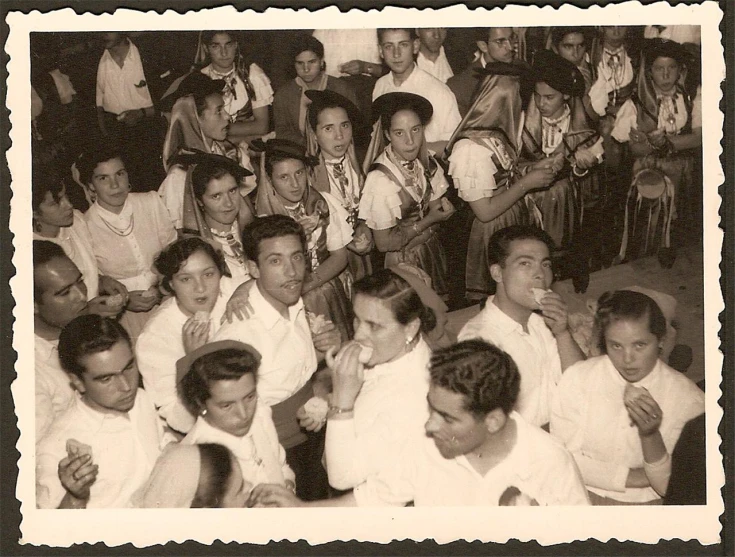 an old black and white po of some men sitting together