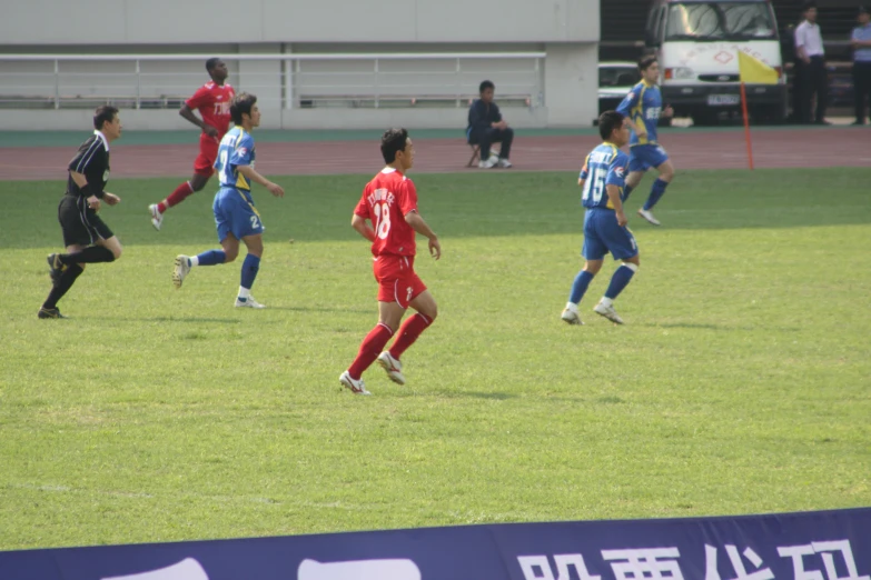 several boys are playing a game of soccer