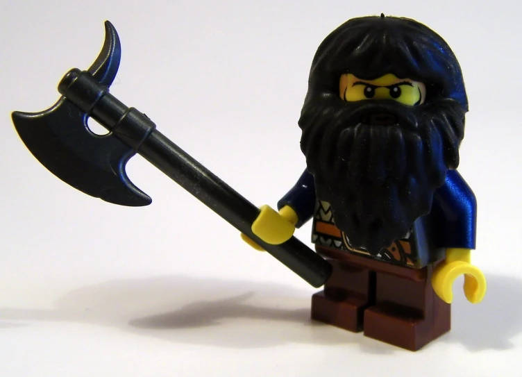 a lego man with a big, heavy, long beard and a black helmet holding a small scammyber