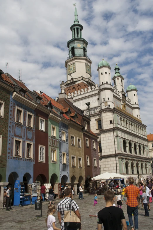 a crowd of people in front of tall buildings