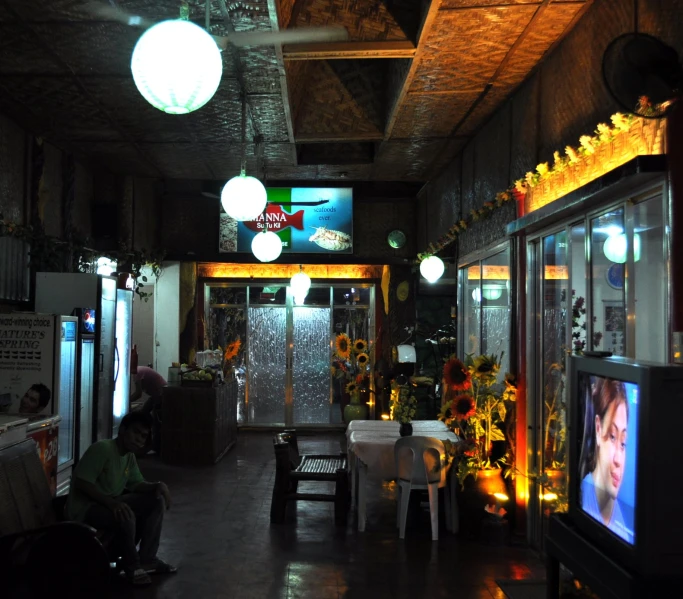 a television shop with various signs on the walls