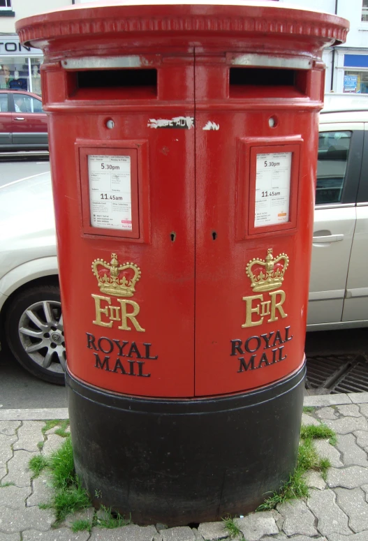 a close up of a british double post mailbox
