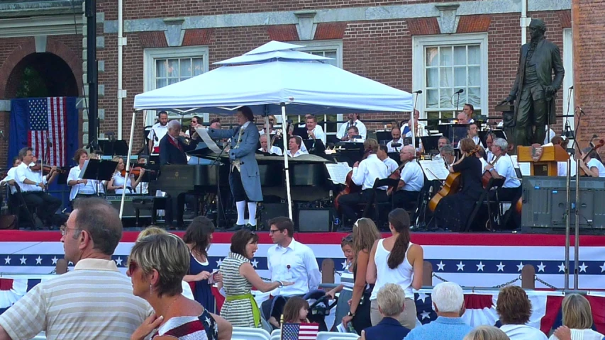 several musical instruments are seen in front of a patriotic building