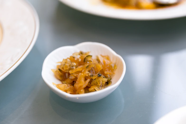 a close up of a bowl of food on the table