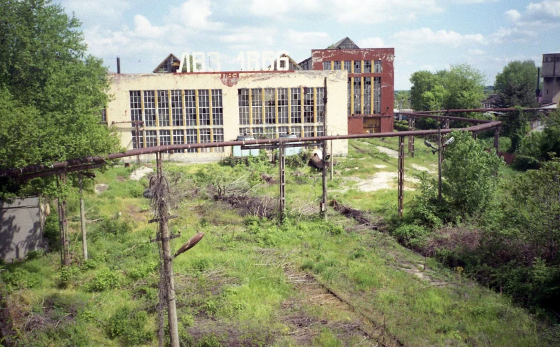 a large building sitting next to a railroad track
