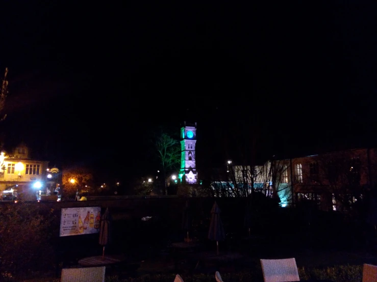 a large building with a tower on top at night