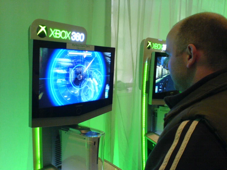 a man is staring at his x box display