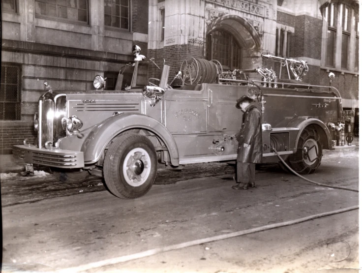 a black and white po of a fire truck in the fire station