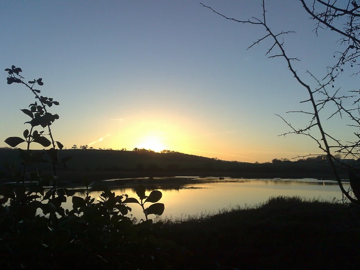 a view of a lake near the sunset