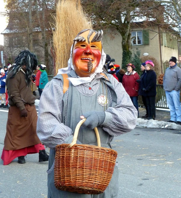 a person dressed as a clown with a basket