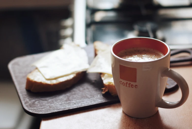 a mug filled with liquid sitting on top of a table