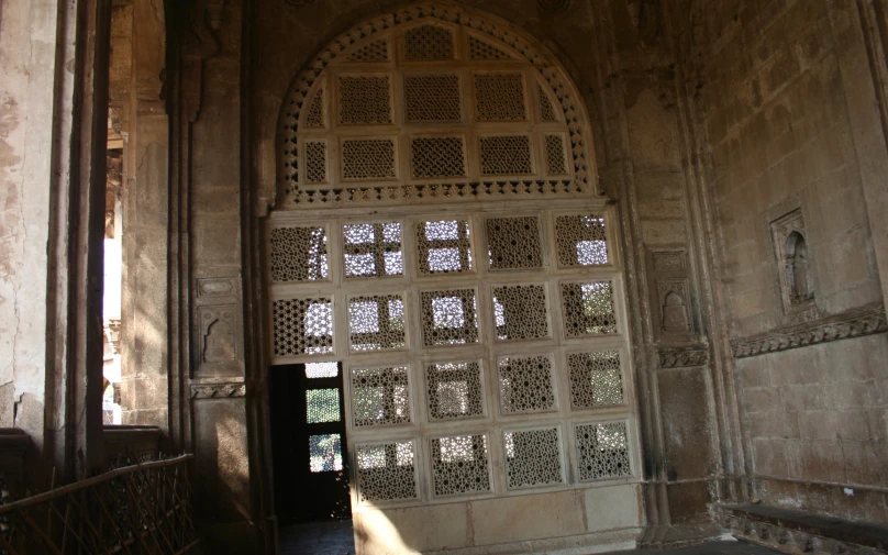 a large arched doorway with glass in the door