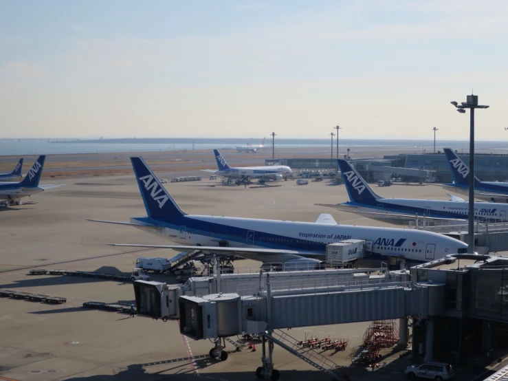 an airport with airplanes and the terminal