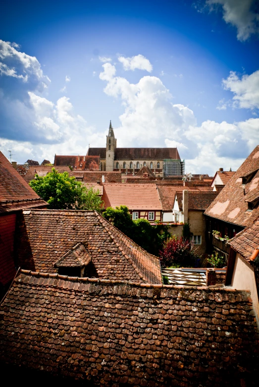 a city skyline with rooftops and brick buildings